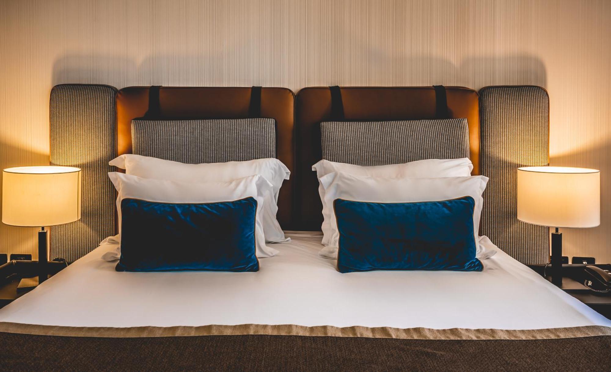Daniel Herzliya Hotel Exterior photo A bed with two pillows
